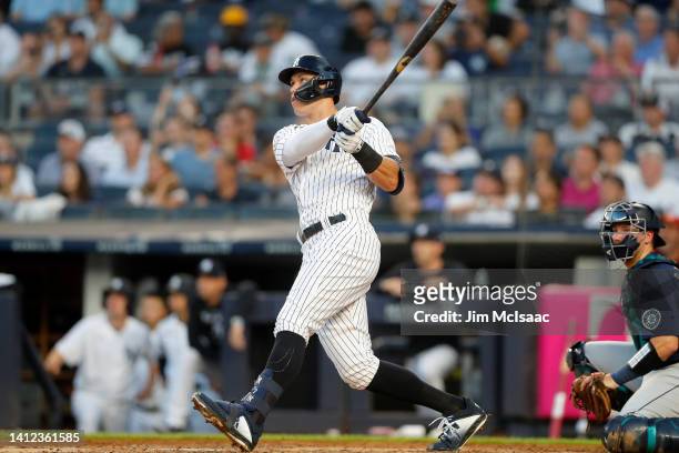 Aaron Judge of the New York Yankees follows through on his second inning two run home run against the Seattle Mariners at Yankee Stadium on August...