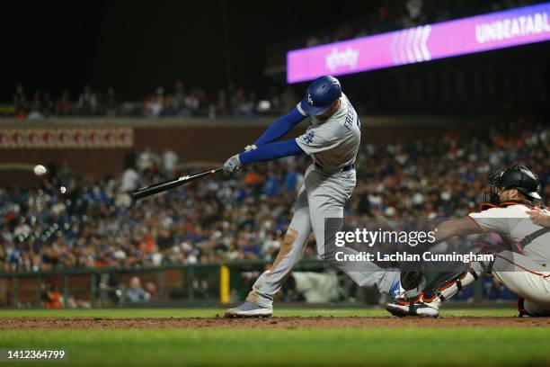 Freddie Freeman of the Los Angeles Dodgers hits an RBI single in the top of the ninth inning against the San Francisco Giants at Oracle Park on...