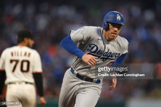 Freddie Freeman of the Los Angeles Dodgers rounds the bases to score on a double by Will Smith in the top of the fifth inning against the San...