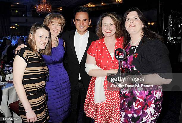 Gareth Gates poses with TV Arts/Documentary Programme award winners for 'The Choir: Military Wives' including Michelle Cooney, Heather Cresswell,...