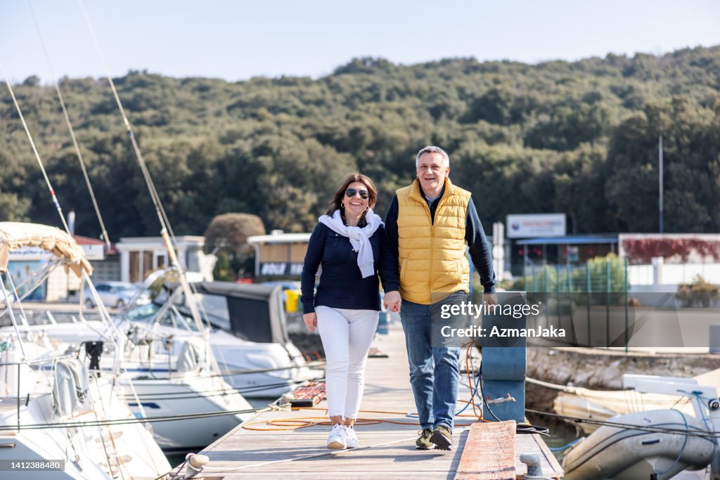 Married Couple Walking At Harbor