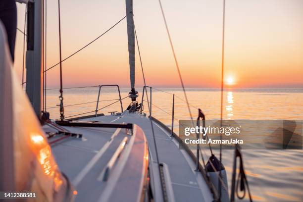 beautiful sundown during a boat trip - sailboat stock pictures, royalty-free photos & images