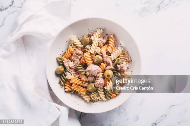 rotini with tuna and olives - macaroni salad stock pictures, royalty-free photos & images