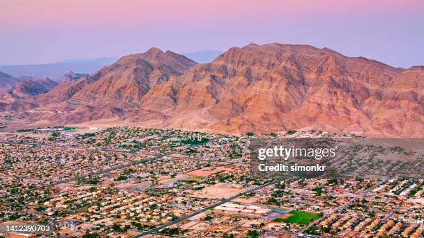 view of frenchman mountain and las vegas neighbourhood - nevada homes stock pictures, royalty-free photos & images