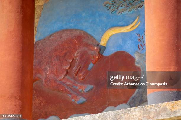 Fresco paintings at the Minoan Palace of ancient Knossos archaeological site on July 22, 2022 in Knossos, Greece.