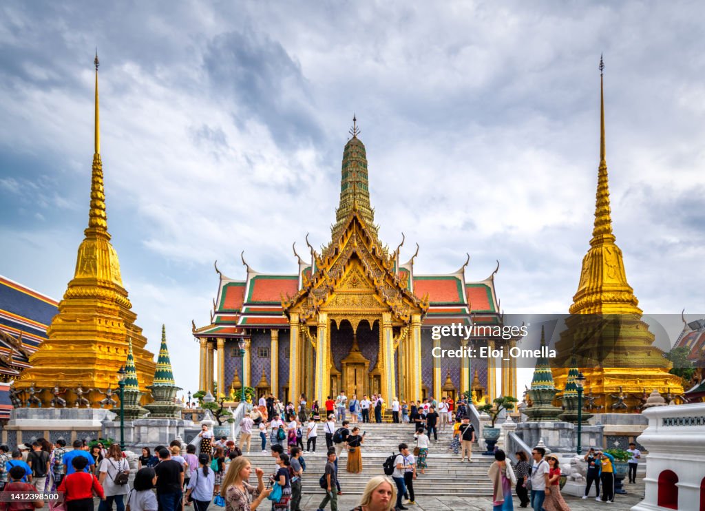 Beautiful building of Wat Phra Kaew Temple of the Emerald Buddha, grand palace on the cloudy sky day, the most famous spot and must visit place and temple in Bangkok, Thailand from the front door