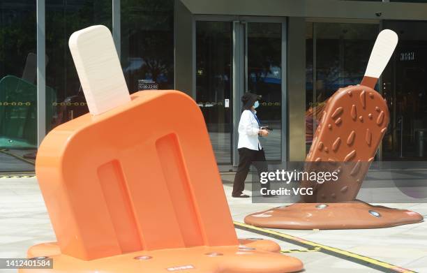 Citizen walks by popsicle-shaped installations outside a shopping mall amid a heat wave on August 2, 2022 in Hangzhou, Zhejiang Province of China.