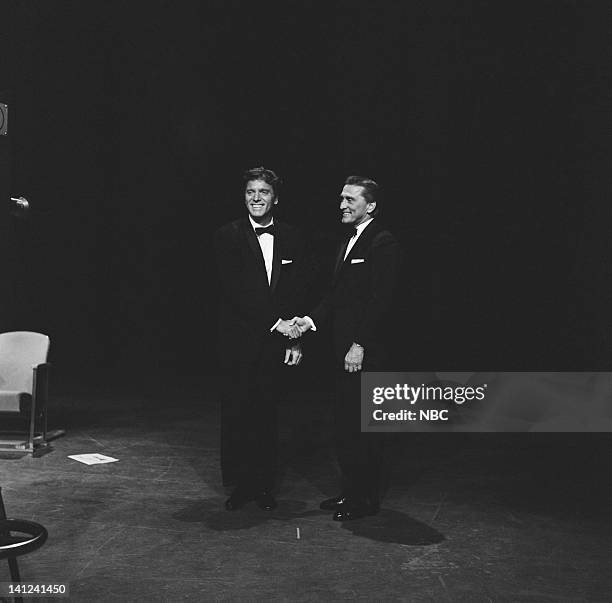 Aired -- Pictured: Actors Burt Lancaster and Kirk Douglas during a pre-taped performance of "It's Alright With Us" for the 31st Annual Academy Awards...