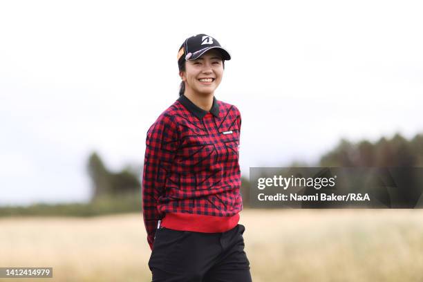 Kotone Hori of Japan smiles to the camera during the Pro-Am prior to the AIG Women's Open at Muirfield on August 02, 2022 in Gullane, Scotland.