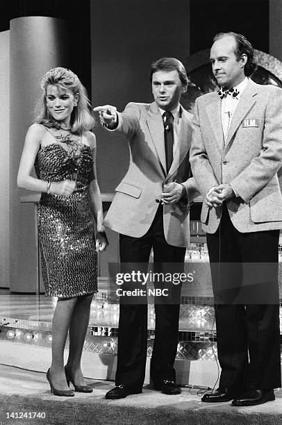 Wheel of Fortune" Episode 8 -- Pictured: Vanna White as herself, Pat Sajak as himself, Dwight Schultz as 'Howling Mad' Murdock -- Photo by: NBCU...