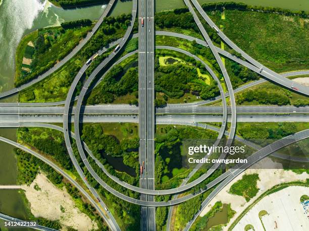 aerial view of traffic and overpasses - overpass stock pictures, royalty-free photos & images