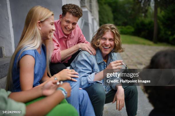 young teenager smoking marihuana cigarettes. - girl smoking - fotografias e filmes do acervo