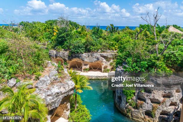 mexican eco friendly tourist attraction with cliffs and a river located in playa del carmen mexico. - mayan riviera stock pictures, royalty-free photos & images