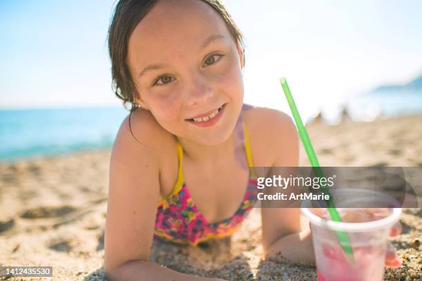 cute little girl on the beach - tween girls swimwear stock pictures, royalty-free photos & images