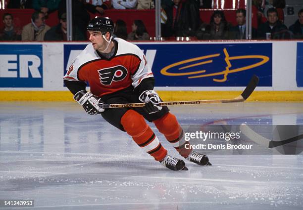 John Leclair of the Philadelphia Flyers skates Circa 1990 at the Montreal Forum in Montreal, Quebec, Canada.