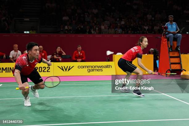 Yong Kai Terry Hee and Jessica Wei Han Tan of Team Singapore compete during their Mixed Team Event Bronze Medal Mixed Doubles match between Team...