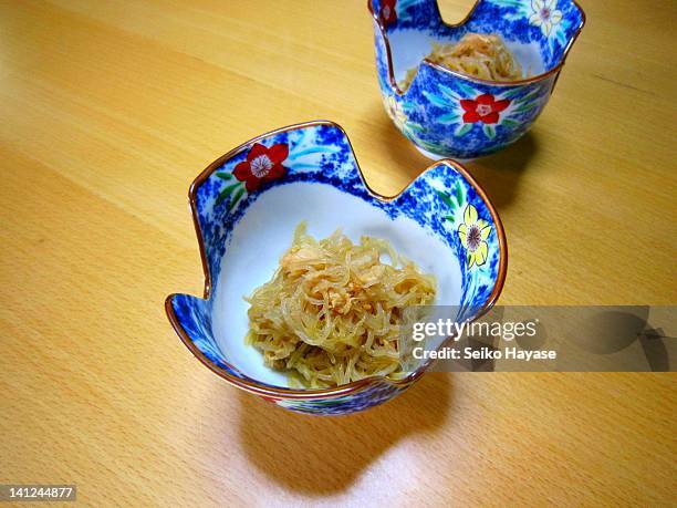 stir-fry of shirataki noodle and tuna - shirataki noodles stock pictures, royalty-free photos & images
