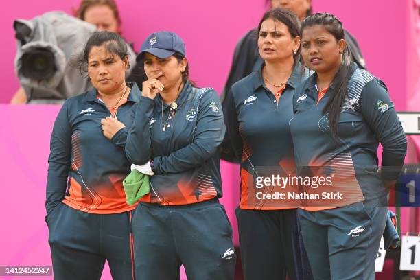 Lovely Choubey, Pinki Nayanmoni Saikia and Rupa Rani Tirkey of Team India look on during the Women's Fours - Gold Medal Match on day five of the...