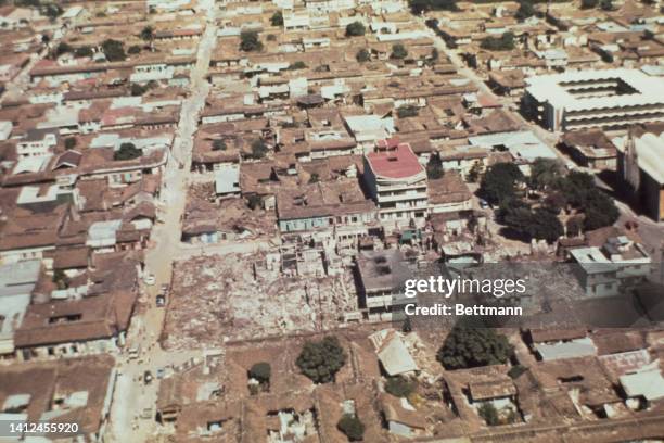 Aerial view shows wide spread damage to Managua almost completely devastated by a series of earthquakes which began December 23: buildings still...