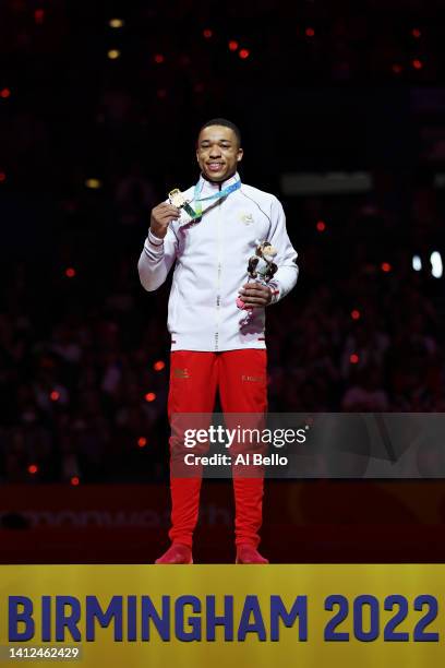 Gold medalist Joe Fraser of Team England poses for a photo during the medal ceremony for Men's Parallel Bars Final on day five of the Birmingham 2022...