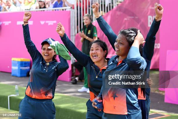 Pinki, Lovely Choubey, Nayanmoni Saikia and Rupa Rani Tirkey and Coach of Team India celebrate their victory in Women's Fours - Gold Medal Match on...