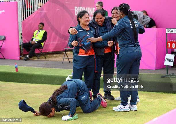 Pinki, Lovely Choubey, Nayanmoni Saikia and Rupa Rani Tirkey and Coach of Team India celebrate their victory in Women's Fours - Gold Medal Match on...
