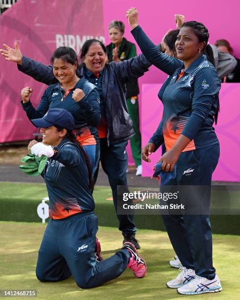 Pinki, Lovely Choubey, Nayanmoni Saikia and Rupa Rani Tirkey and Coach of Team India celebrate their victory in Women's Fours - Gold Medal Match on...