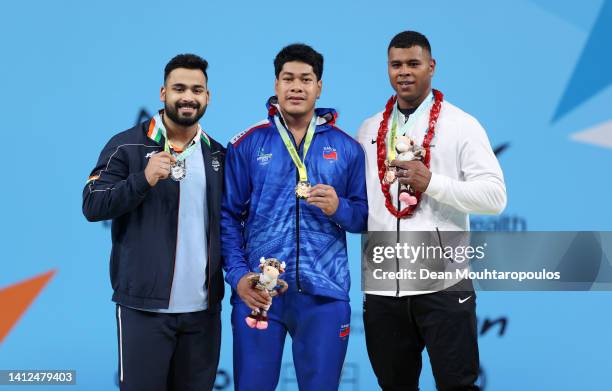 Silver Medalist, Vikas Thakur of Team India, Gold Medalist, Don Opeloge of Team Samoa and Bronze Medalist, Taniela Tuisuva Rainibogi of Team Fiji...