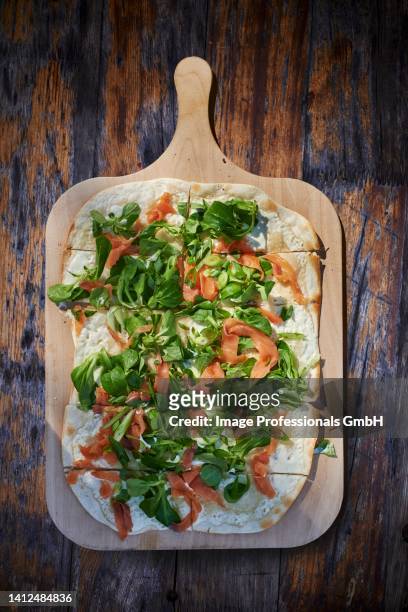 tarte flambée with smoked salmon and lamb's lettuce - rectangle pizza stock pictures, royalty-free photos & images