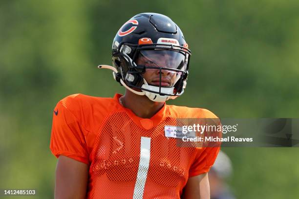 Justin Fields of the Chicago Bears looks on during training camp at the PNC Center at Halas Hall on August 02, 2022 in Lake Forest, Illinois.