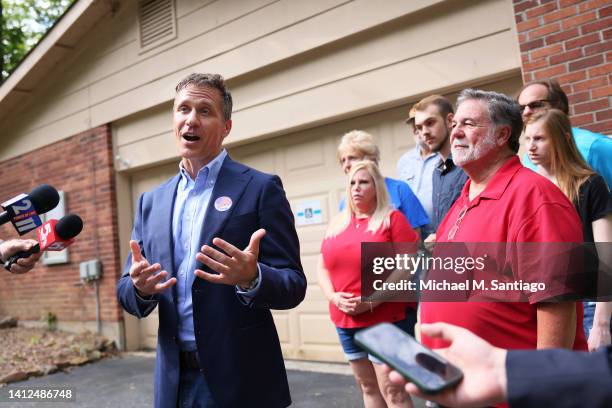 Former Missouri Gov. And Missouri Senate Candidate Eric Greitens speaks with reporters after voting during Primary Election day at the Village Hall...