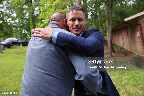 Former Missouri Gov. And Missouri Senate Candidate Eric Greitens greets supporters after voting during Primary Election day at the Village Hall on...