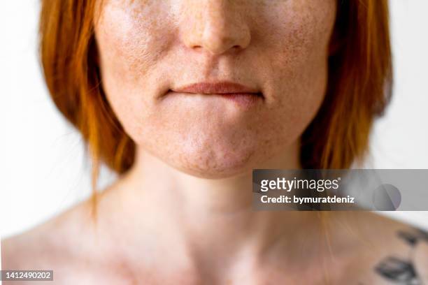 woman biting her lip - cream mouth stock pictures, royalty-free photos & images