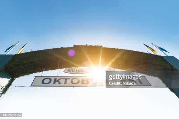 octoberfest welcoming entrance - theresienwiese stock pictures, royalty-free photos & images