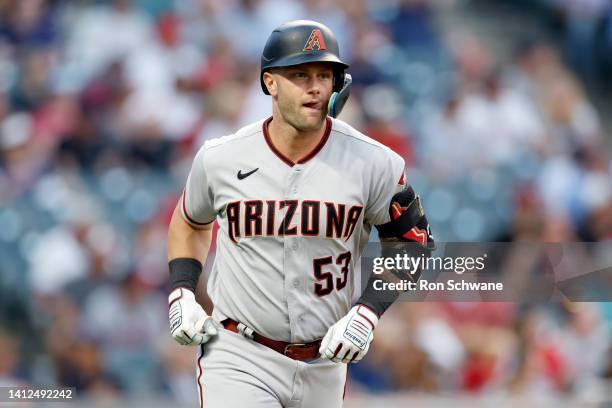 Christian Walker of the Arizona Diamondbacks rounds the bases after hitting a three-run home run off Cal Quantrill of the Cleveland Guardians during...