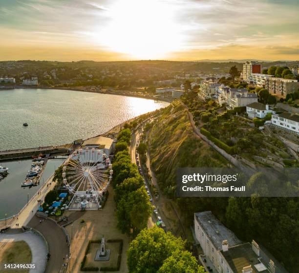 torquay seafront at sunset - torquay stock pictures, royalty-free photos & images