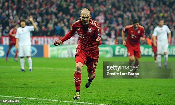 Arjen Robben of Muenchen celebrates after scoring his teams first goal during the UEFA Champions League Round of 16 second leg match between FC...