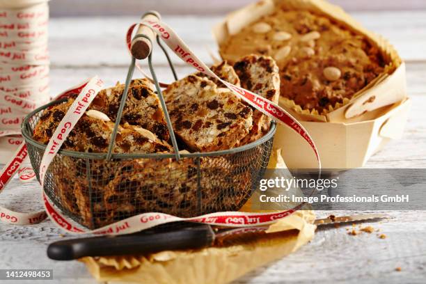 mini fruit bread in a metal basket and a wooden basket - gourmet gift basket fotografías e imágenes de stock