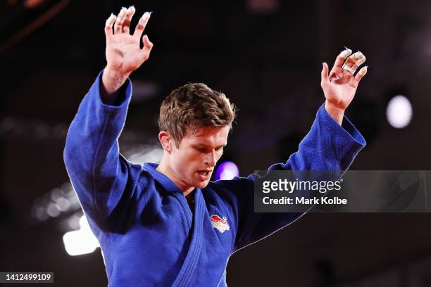 Daniel Powell of Team England celebrates after winning during their Men's Judo -73kg Final match against Faye Njie of Team Gambia on day five of the...