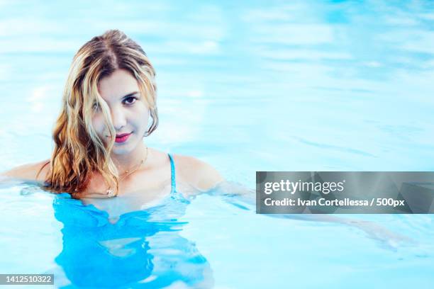 a beautiful girl in a swimming pool,italy - woman swimsuit happy normal stock pictures, royalty-free photos & images