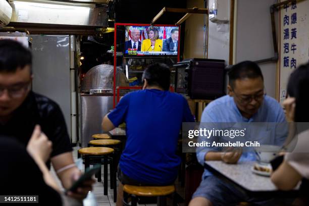 Television broadcasts news about Speaker of the House Nancy Pelosi at a local restaurant on August 02, 2022 in Taipei, Taiwan. Pelosi arrived in...