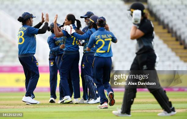 Inoka Ranaweera of Team Sri Lanka celebrates with teammates after taking the wicket of Amelia Kerr of Team New Zealand during the Cricket T20 Group B...