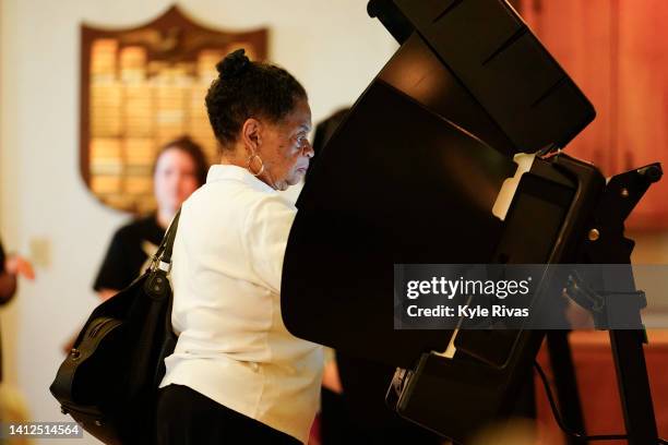 Voter cast their ballot in the Kansas Primary Election at Merriam Christian Church on August 02, 2022 in Merriam, Kansas. Voters in Kansas will...