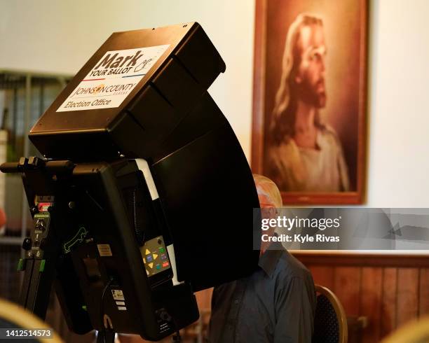 Voter cast their ballot in the Kansas Primary Election at Merriam Christian Church on August 02, 2022 in Merriam, Kansas. Voters in Kansas will...