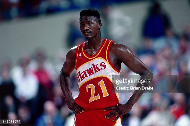 Dominique Wilkins of the Atlanta Hawks looks on against the Portland Trailblazers at the Veterans Memorial Coliseum in Portland, Oregon circa 1989....