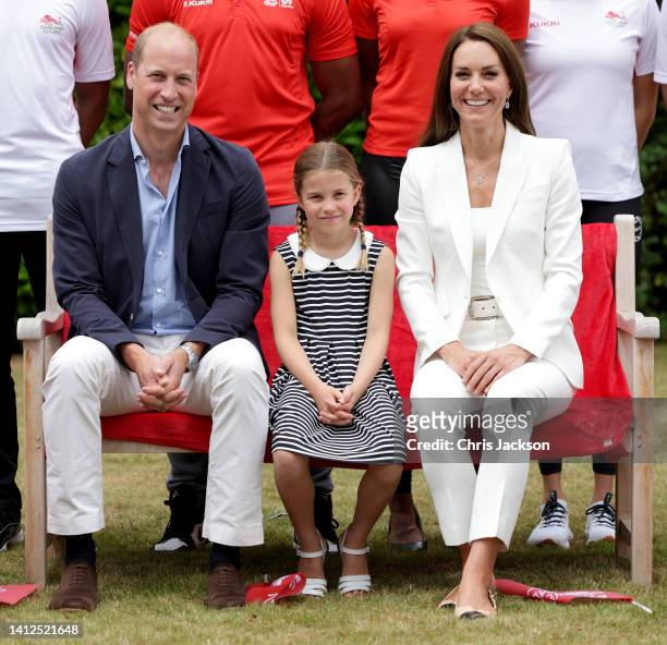 Prince William, Duke of Cambridge, Catherine, Duchess of Cambridge and Princess Charlotte of Cambridge pose for a photograph as they visit SportsAid...
