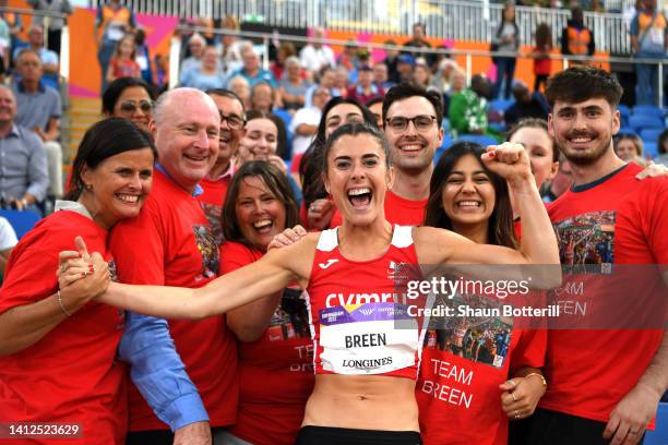 Olivia Breen of Team Wales celebrates with their family after winning the Gold Medal in the Women's T37/38 100m Final on day five of the Birmingham...