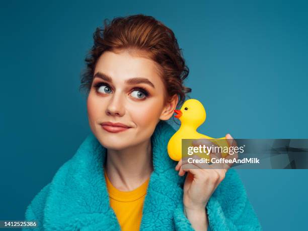 beautiful woman holding rubber duck - rubber duck stock pictures, royalty-free photos & images