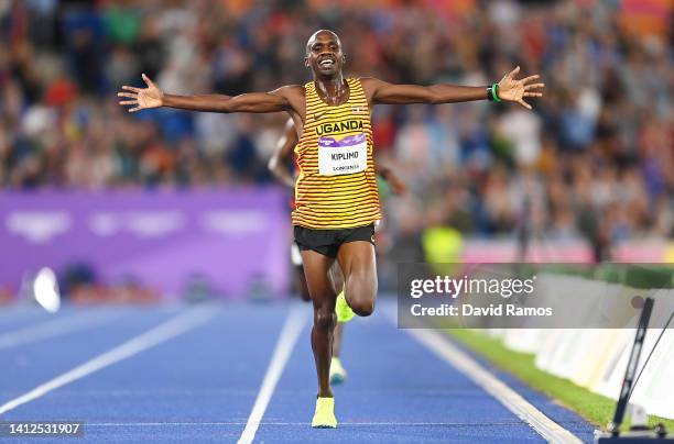 Jacob Kiplimo of Team Uganda celebrates winning the Gold medal as they cross the finish line in the Men's 10,000m Final on day five of the Birmingham...