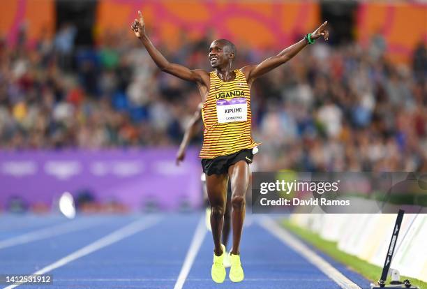 Jacob Kiplimo of Team Uganda celebrates winning the Gold medal as they cross the finish line in the Men's 10,000m Final on day five of the Birmingham...